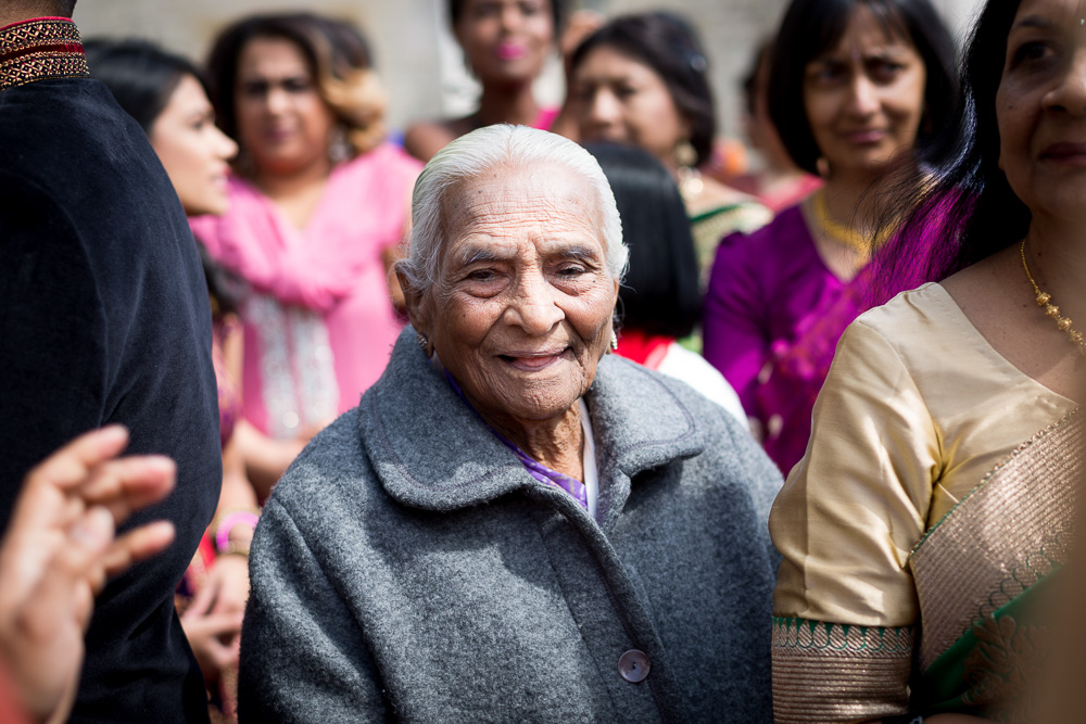 grandmother wedding guest smiling in the crowd