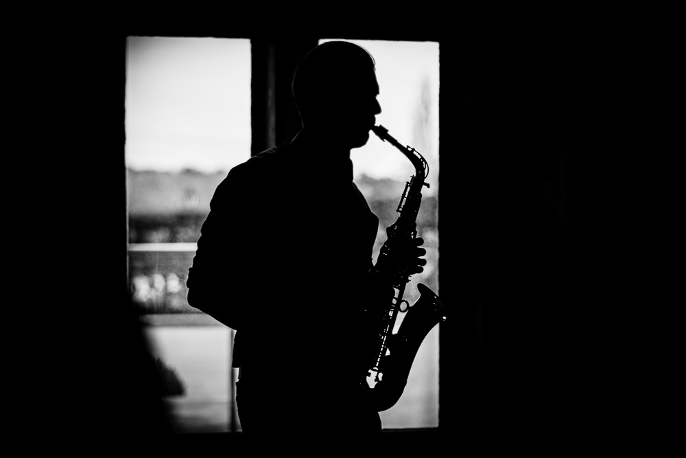 black and white silouhette of saxophone player