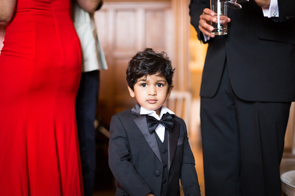 dapper young wedding guest in a tuxedo