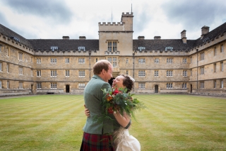 Bride and groom laughing at Wadham college Oxford wedding
