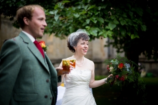 Bride and groom drinking pims