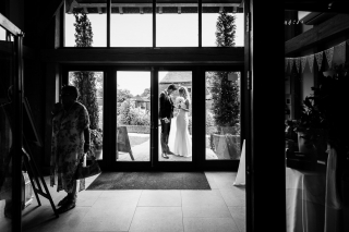 bride and groom having a moment before entering the reception