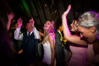 laughing dancing bride at The old Kent Barn wedding