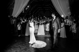 Black and white shot of the first dance at The old Kent Barn wedding