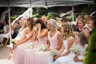 beautiful bridesmaid wearing pink dresses and crying at The old Kent Barn