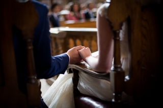 bride and groom holding hand shot