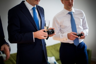groom and best man playing video games in London