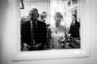 bride and her father waiting at the door