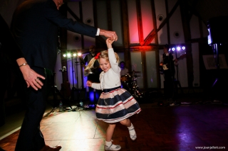 little girl dancing with her daddy