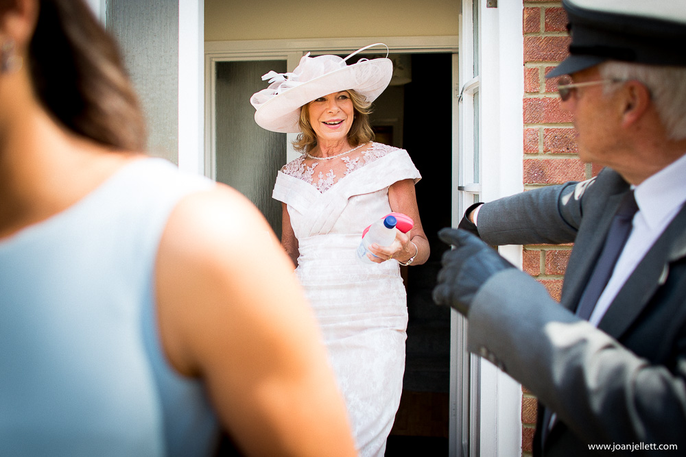 mother of the bride coming out of the house