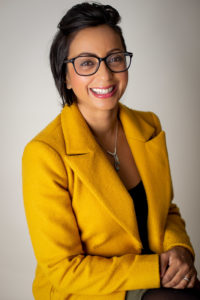 CEO of Bournemouth headshot session wearing a yellow suit jacket