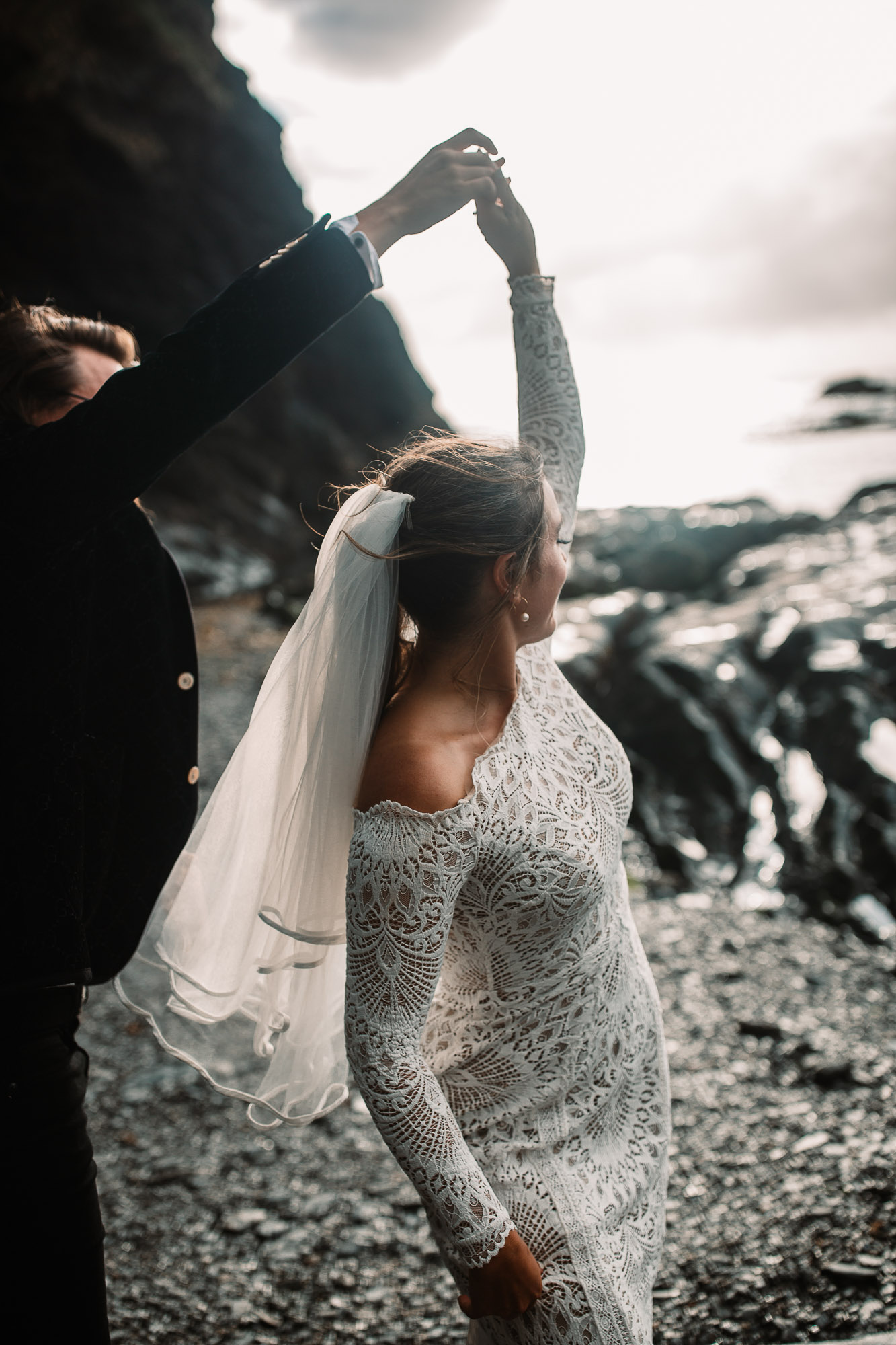 bride and groom dancing at tunnels beaches golden hour