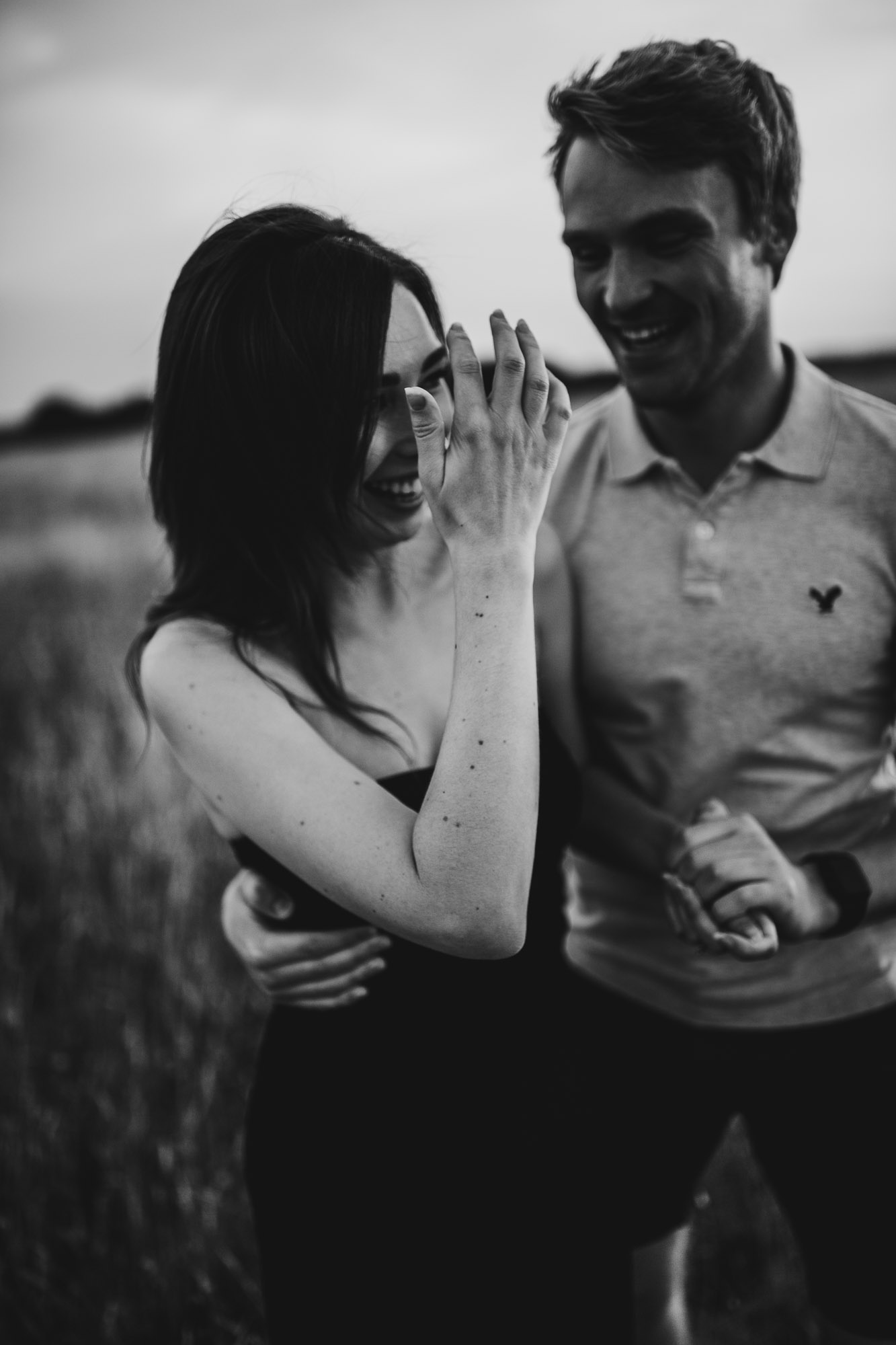 black and white shot of couple laughing
