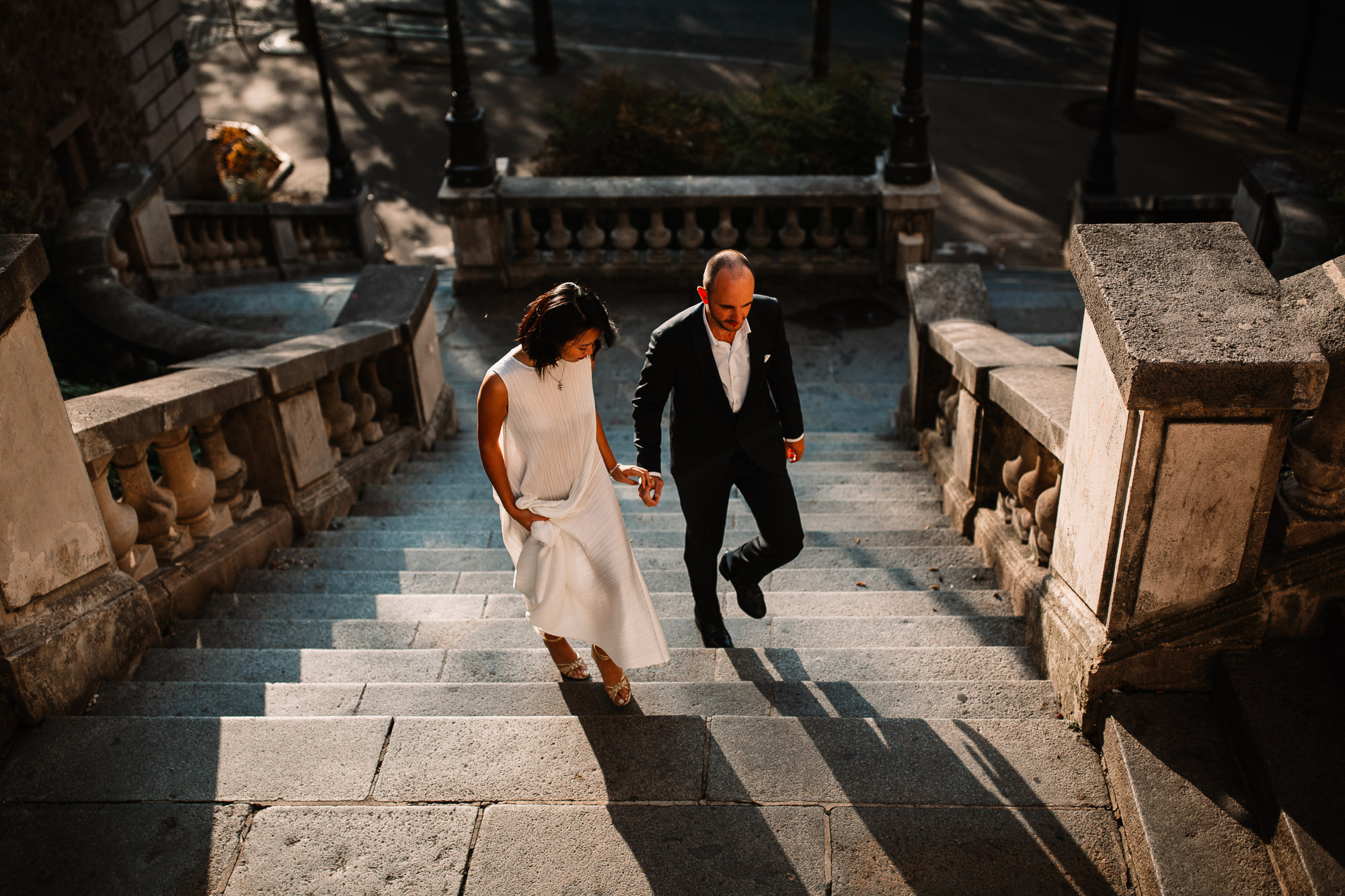 couple walking up the stairs in paris