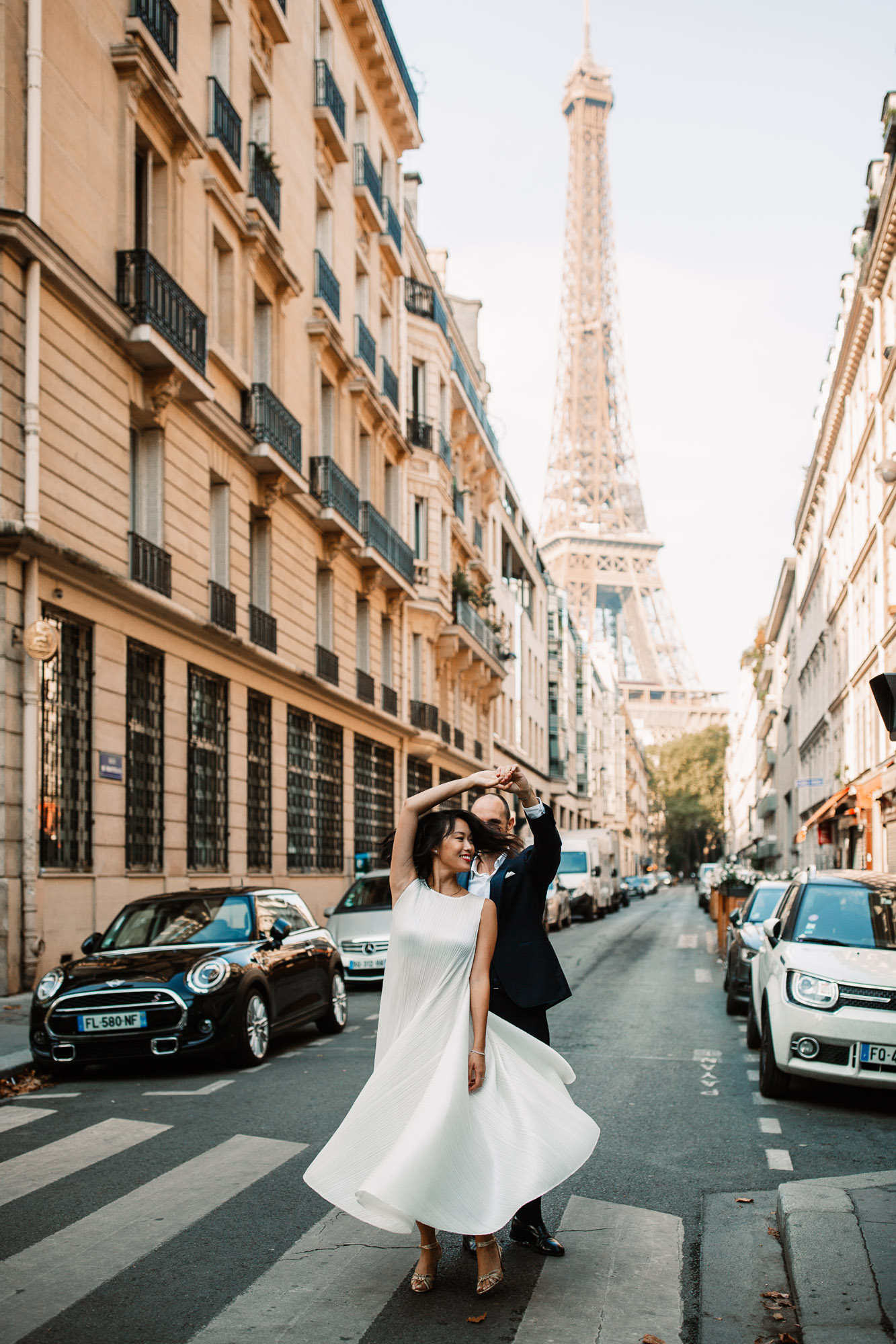 bride spinning in Paris on the pedestrian crossing in Paris