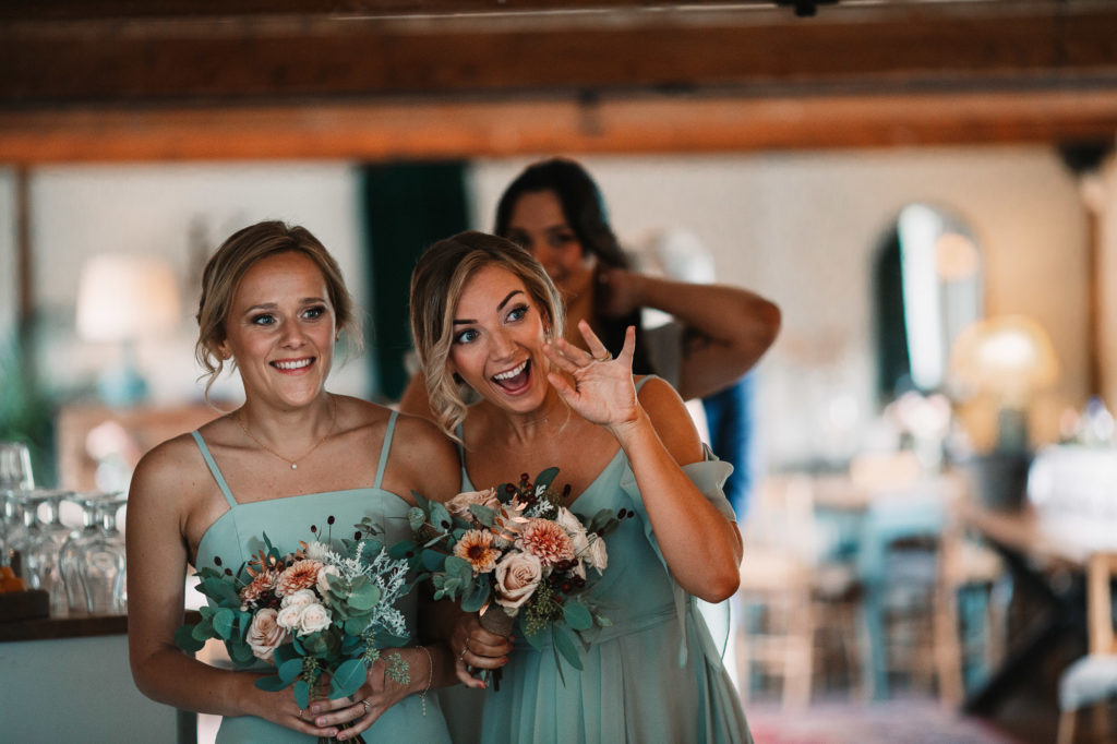 bridesmaids waving and smiling