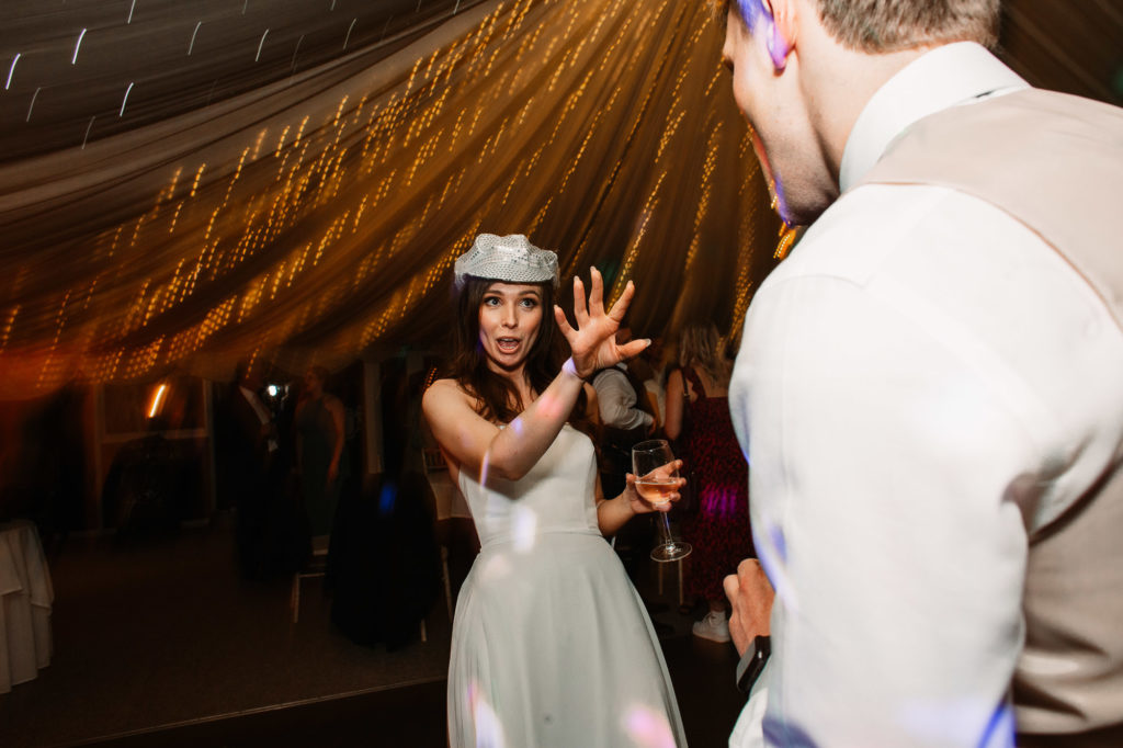 bride pulling some funny moves on the dance-floor in parley manor