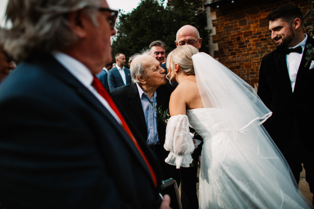 bride kissing her grandfather