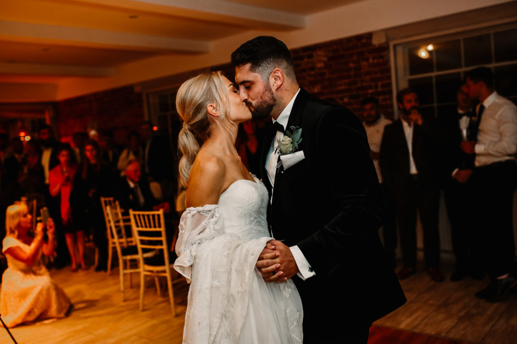 bride and groom kissing on the dancefloor
