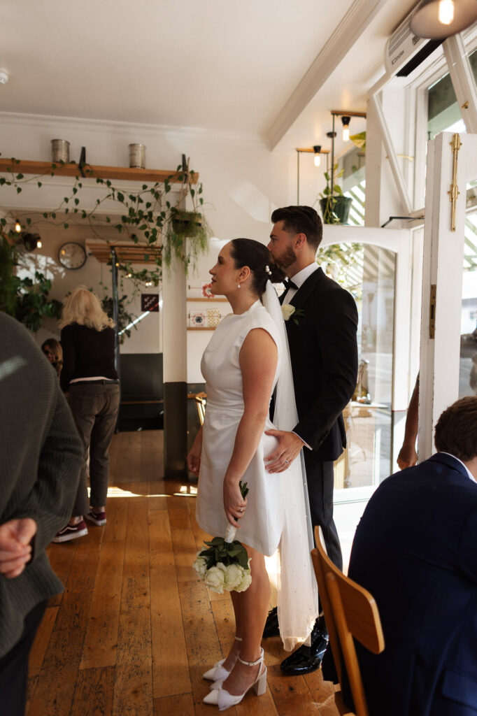 bride and groom entering in a cafe in Marylebone
