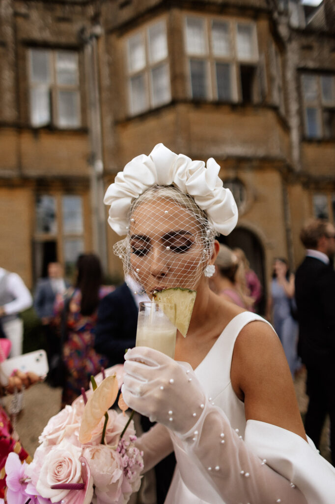 bride sipping a cocktail