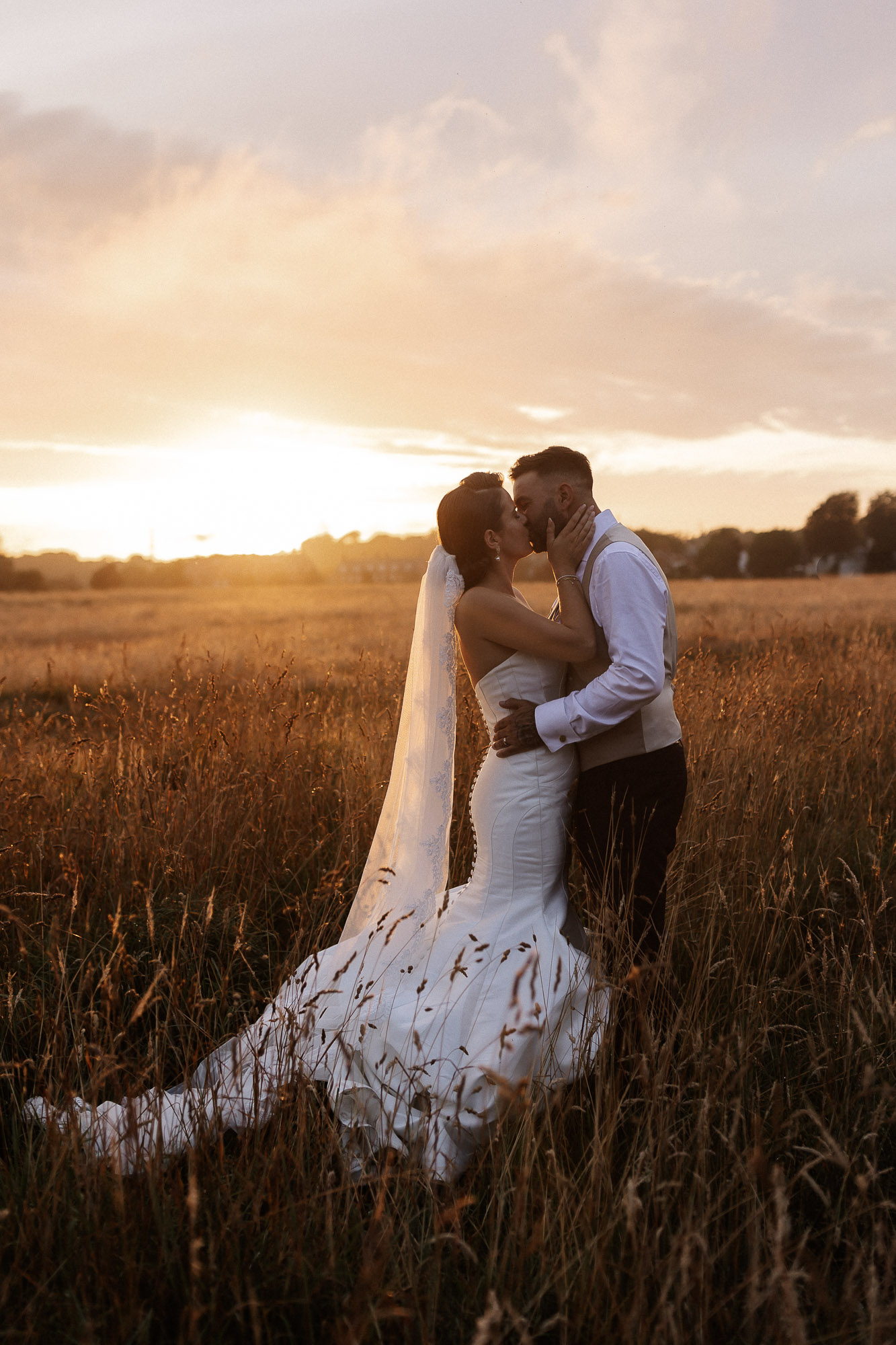 bride kissing in Deanscourt golden hour