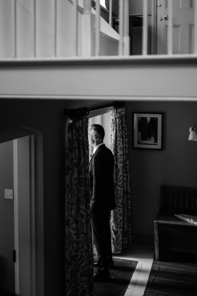 father of the bride looking outside the window