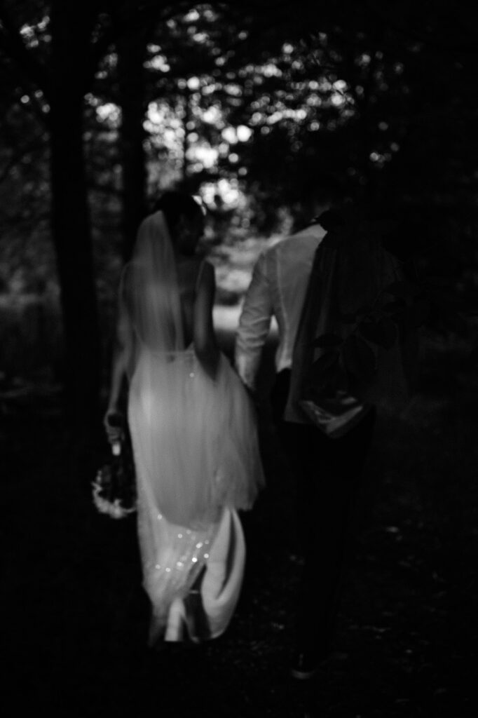 black and white back shot of bride and groom