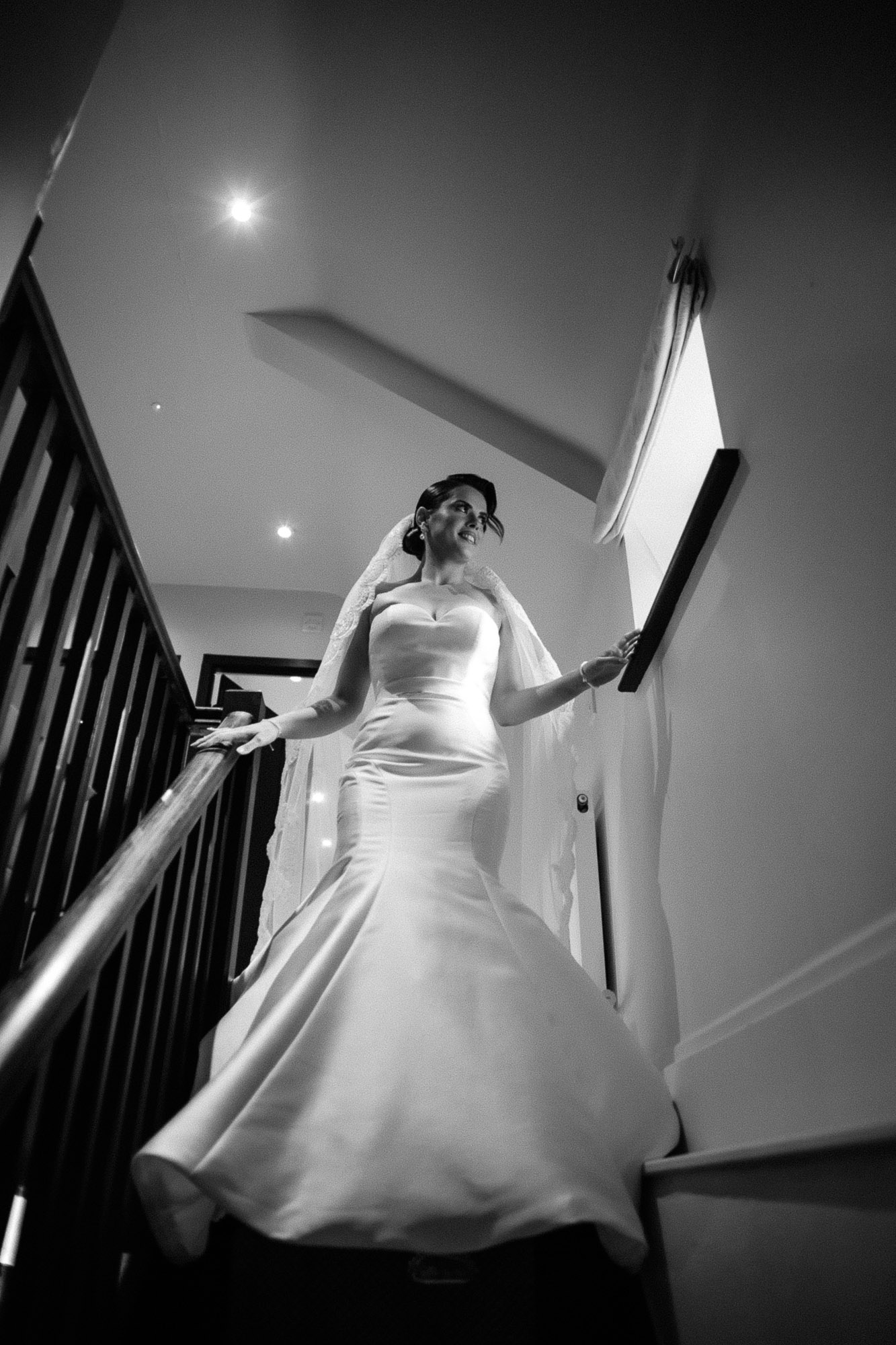 bride walking down the aisle in black and white