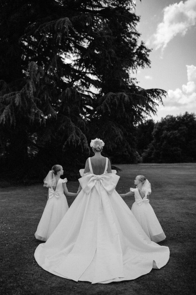 bride and her daughters walking to the venue